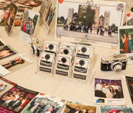 Event photo booth prints and memories displayed inside Meadow Tree Marquee