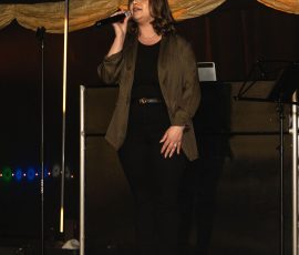 Live vocalist performing on stage at Meadow Tree Marquee
